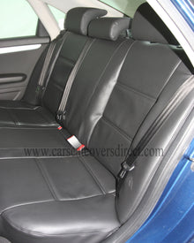 Audi A4 B7 - Black Leatherette & Fabric Centre